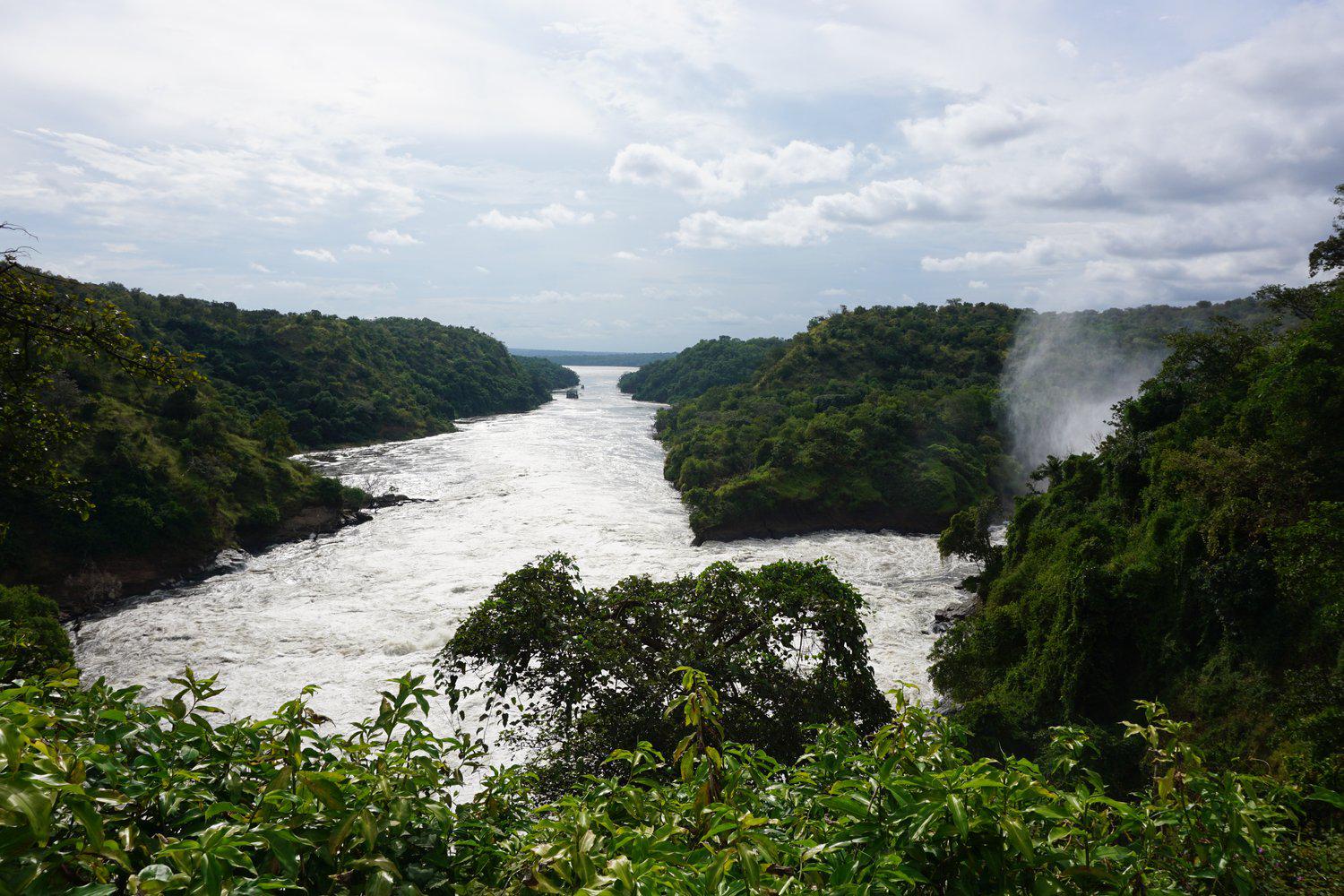 River landscape in Uganda surrounded by lush green hills – DoGood Earth sustainable farming region