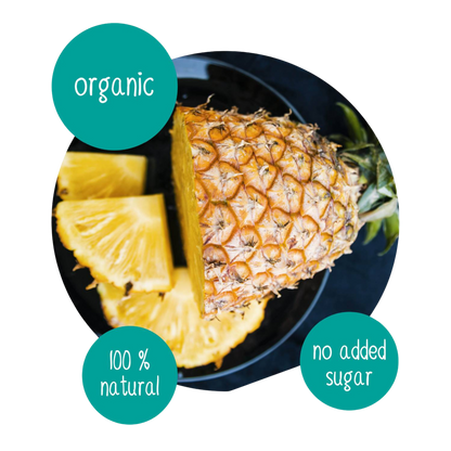 Fresh organic pineapple with sliced wedges on a plate, labeled 100% natural with no added sugar, tropical fruit ingredient for Do Good dried pineapple snacks