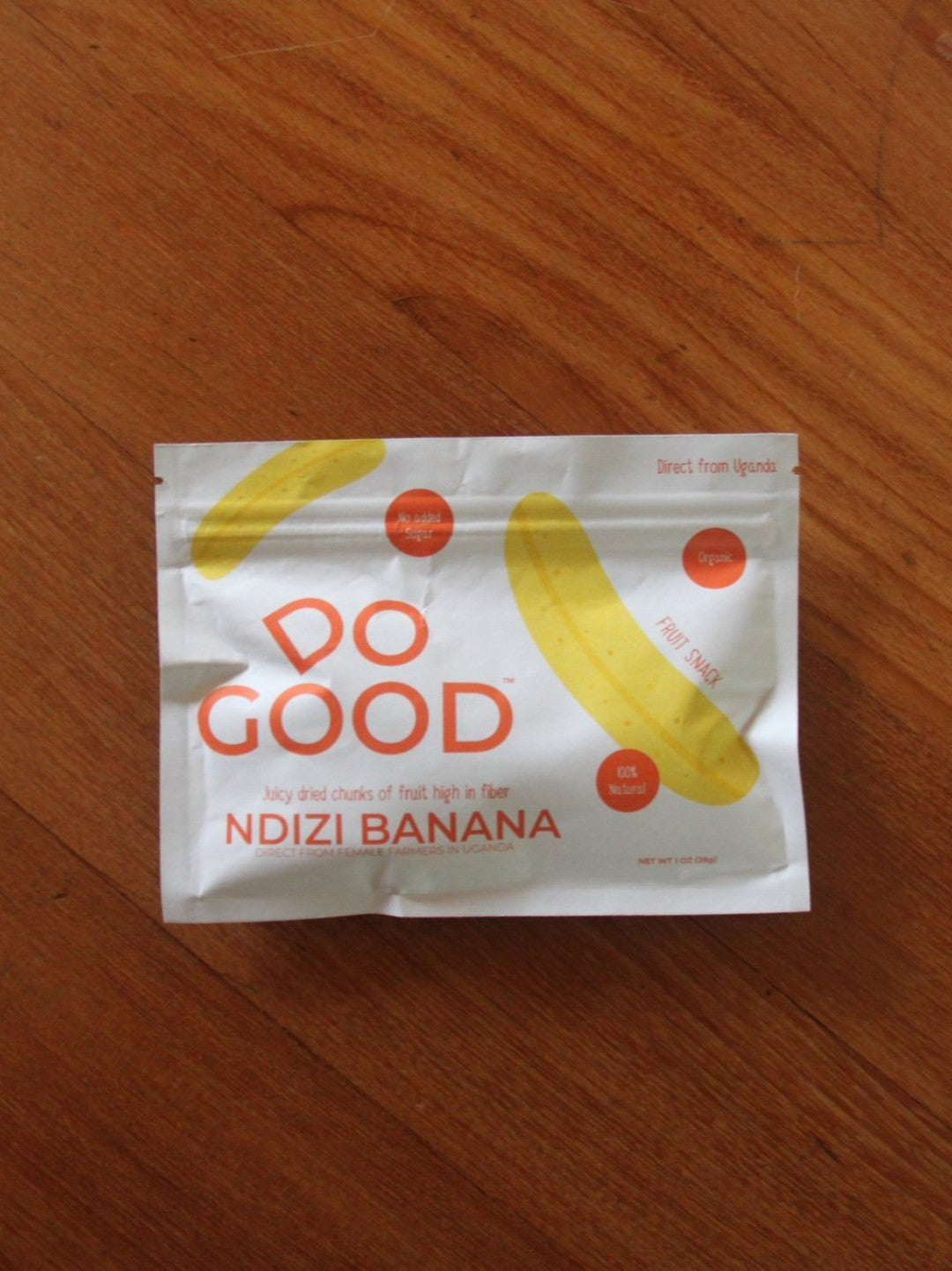 DoGood Ndizi Banana dried fruit snack pack on wooden background, organic healthy snack with no added sugar from Uganda